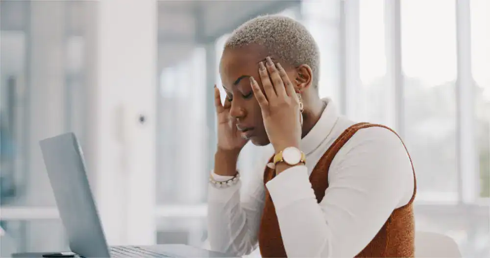 A visibly frustrated salesperson or business professional showing signs of stress, exhaustion, or disappointment, possibly sitting at a desk or in an office environment. This image represents the constant effort and energy drain that traditional sales methods and paid advertising campaigns require from Kenyan businesses. Unlike SEO which works continuously in the background, conventional advertising and active sales outreach demand ongoing investment, management, and attention, with results disappearing the moment the effort or budget stops, leaving business owners perpetually chasing the next customer.